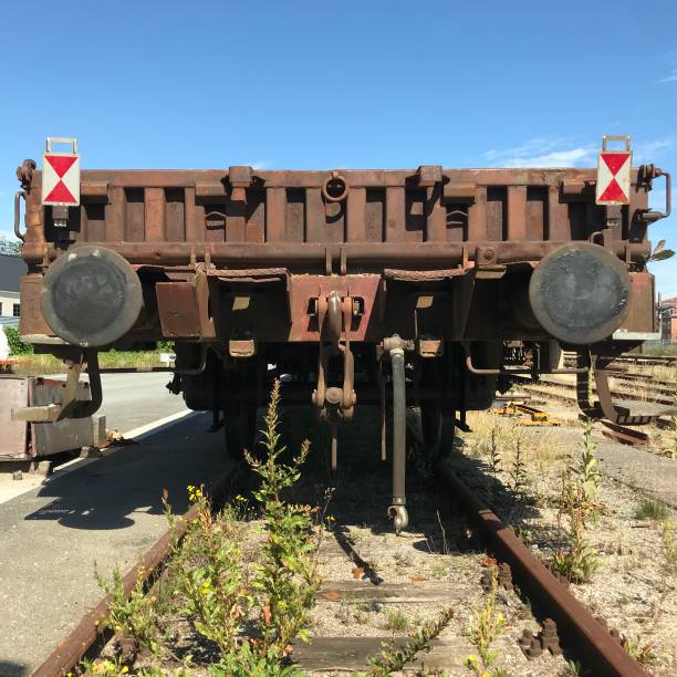 direct front view: end of old and rusty railway carriage no longer in use.